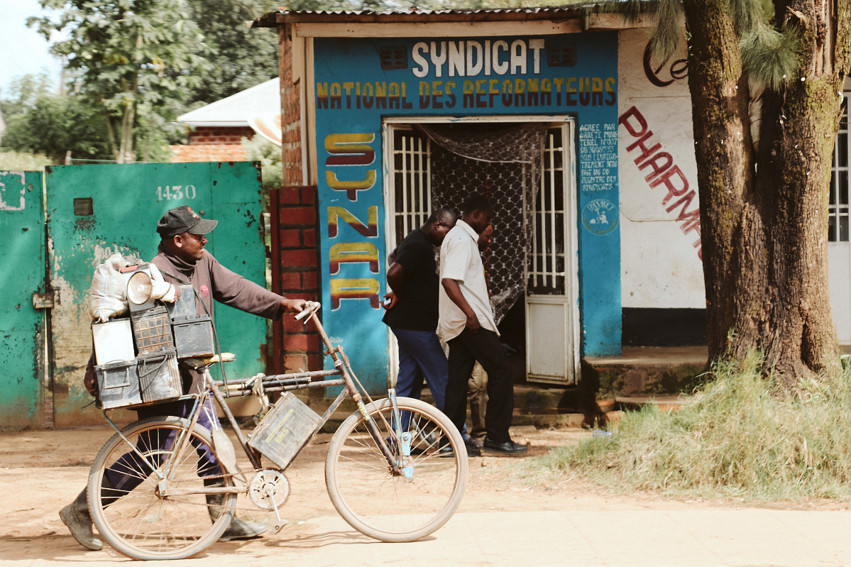 Man in Congo collecting batteries